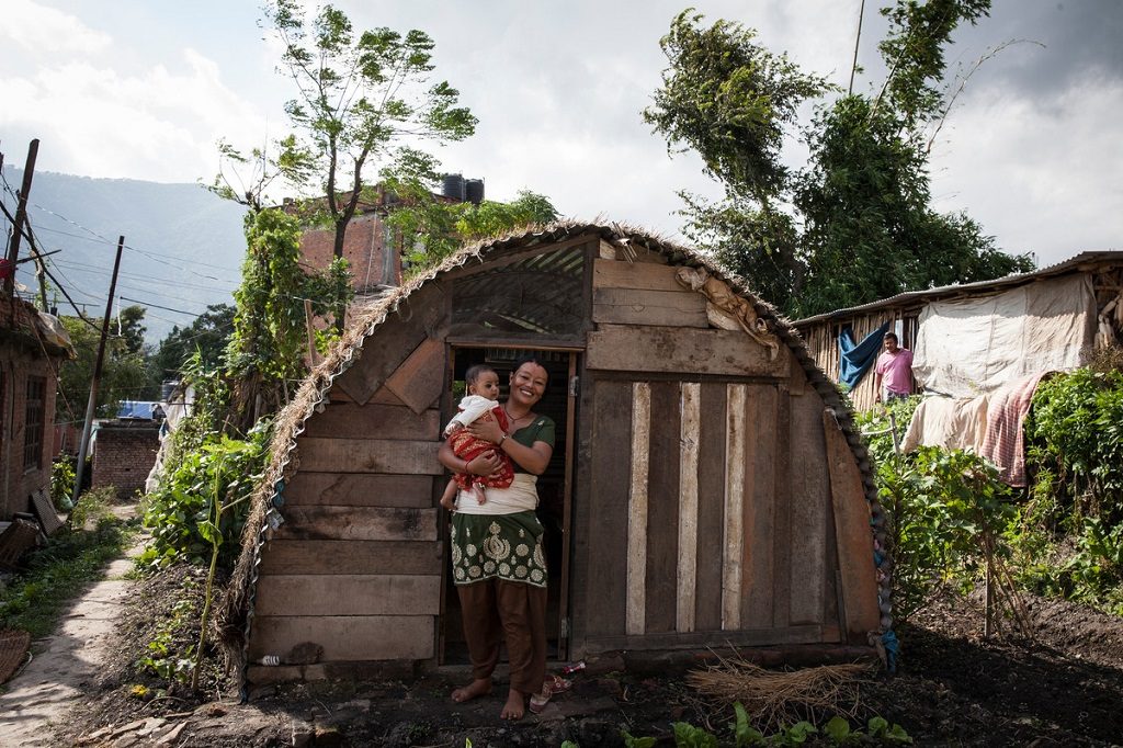 Puja Maharjan (above), a new mom, moved into a semi-permanent shelter 6 months after Nepal’s devastating earthquake. Photo: Kishor K. Sharma/ActionAid