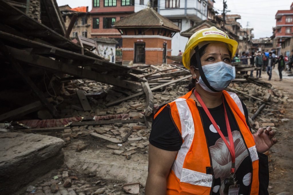Malati Maskey from ActionAid Nepal surveys the earthquake damage in Khokhana. Photo: Vlad Sokhin/ActionAid