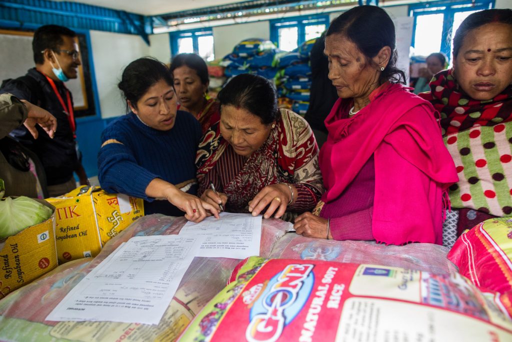 A local women's network supported by ActionAid coordinates an aid delivery. Photo: Prashanth Vishwanathan