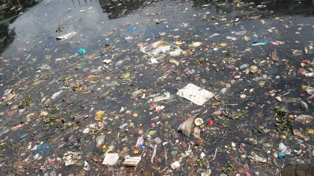 Plastic waste floating in the Buriganga, a dead river.