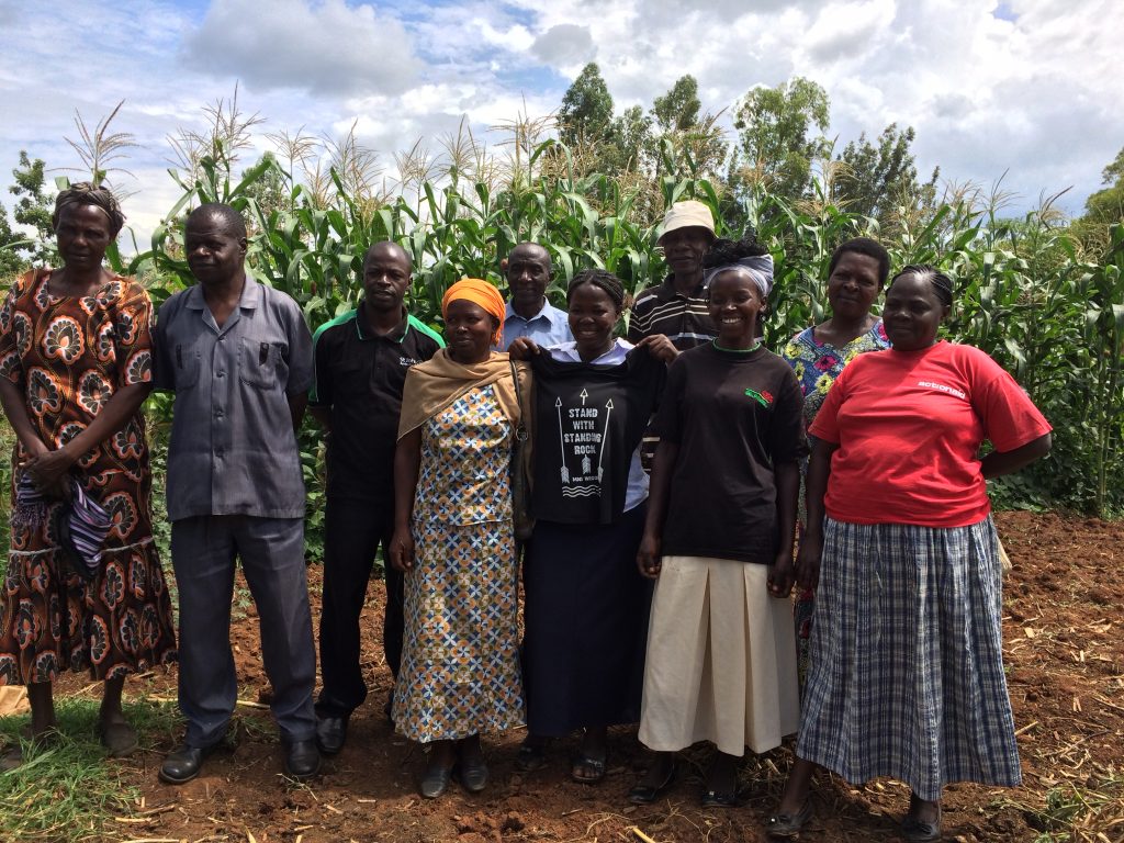 Local farmers from Kenya stand with Standing Rock