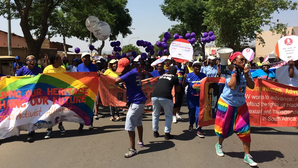 Black LGBTQI activists in South Africa dance in the street during a Pride parade
