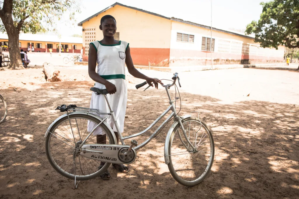 Eunice with her bike in Ghana