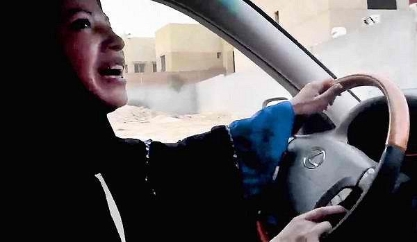A woman in Saudi Arabia drives. Until September 2017 Saudi women were banned by law from driving.