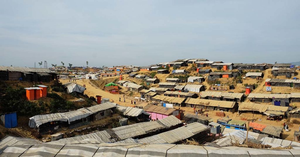 Dozens of shacks made with bamboo and tarpaulin lining a slope in Cox's Bazar, Bangladesh, offer a sense of safety to the Rohingya refugees staying there.