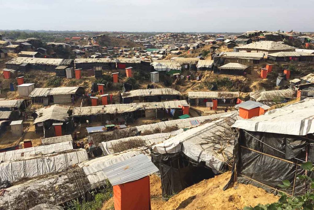 Bamboo structures topped with tarp line the slopes in Cox's Bazar, Bangladesh. ActionAid works with Rohingya women as part of our response to the Rohingya refugee crisis.