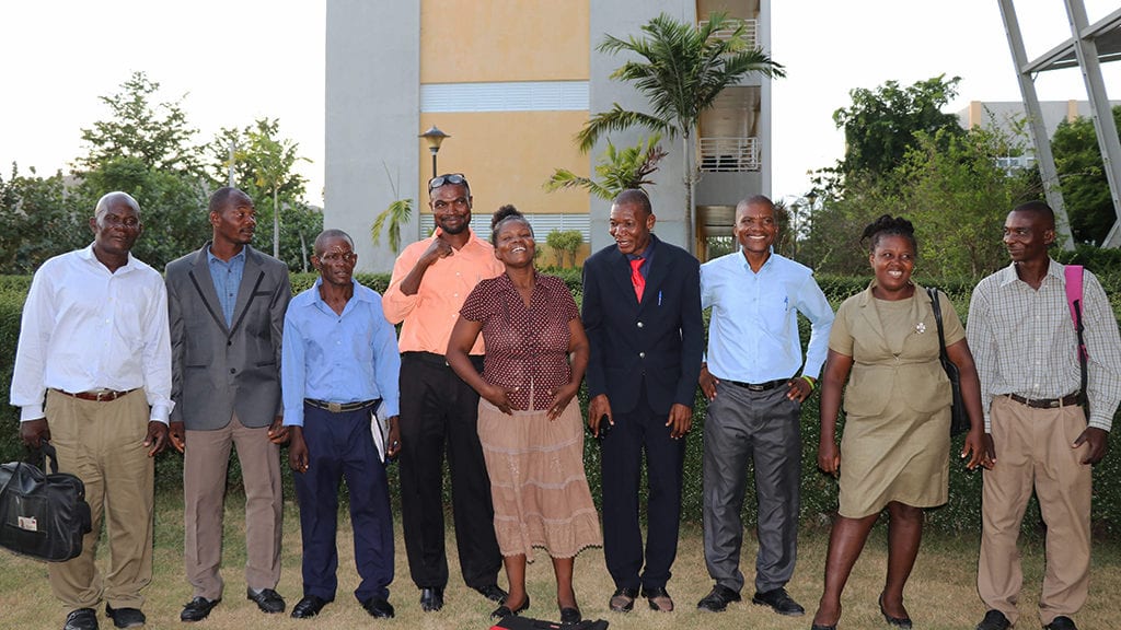 Members of the Kolektif and their advisor celebrate after signing the agreement.