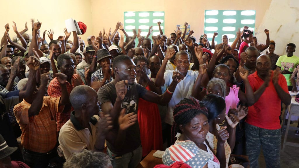 Haitian farmers from the Kolektif vote to approve the agreement.