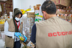 Volunteers in Palestine packaging food for distribution for families that have been hit hard by coronavirus