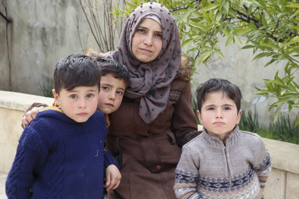Noor, with her three boys. Photo: Sonya Al Ali Maara/ActionAId