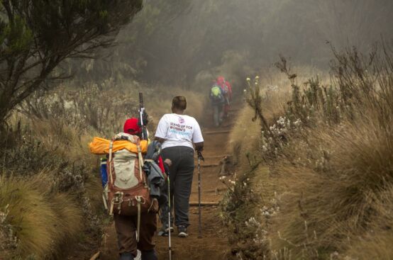 Cecilia, a farmer from Kenya, climbs Kilimanjaro’s slopes. Photo: Georgina Goodwin/ActionAid