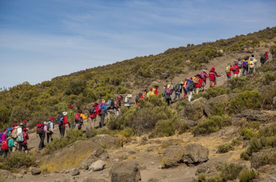 African women farmers and their guides head toward Kilimanjaro’s summit. Photo: Georgina Goodwin/ActionAid