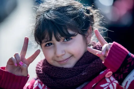 A young girl from Syria at a refugee camp on the island of Lesvos, Greece. Photo: Karin Schermbrucker/ActionAid