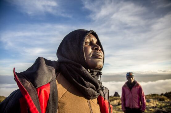 Mary, a farmer from Kenya, takes in Kilimanjaro’s summit. Photo: Georgina Goodwin/ActionAid