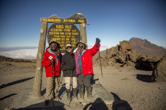 Polly and Irene, rural women’s leaders and farmers from Uganda, at Kibo Hut, 4,720 m. up Kilimanjaro with Lyn, who climbed the mountain in solidarity with them. Photo: Georgina Goodwin/ActionAid