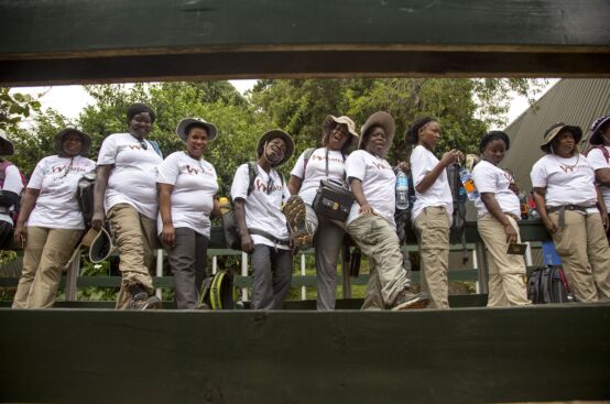 Farmers line up to register with Kilimanjaro National Park before starting their climb. Photo: Georgina Goodwin/ActionAid