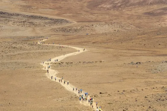 Heading across “The Saddle” toward Kilimanjaro’s summit. Photo: Georgina Goodwin/ActionAid