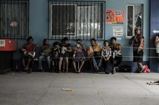 Indigenous women waiting outside Sayaxche Hospital. Photo: ActionAid